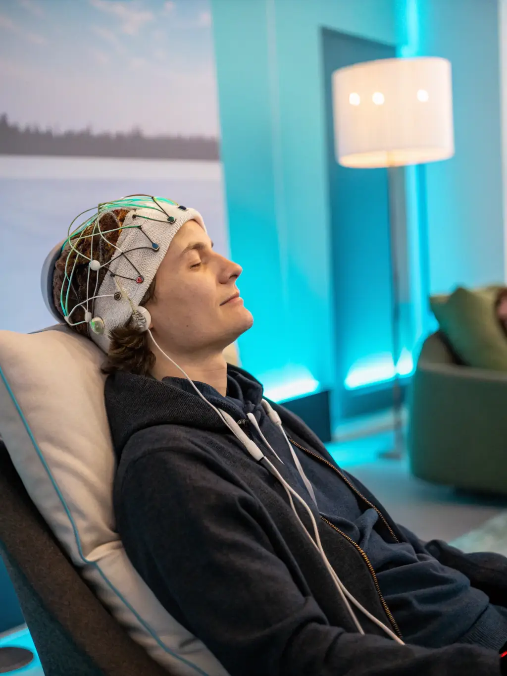 A person using biofeedback equipment with a therapist present, showcasing the integration of technology in Lumina Behavioral Health's outpatient services.
